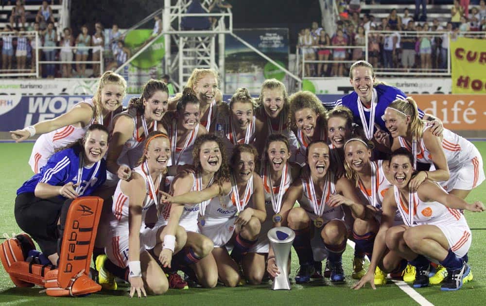 Netherlands` players pose for photographers with the trophy after defeating Australia 5-1 during the women`s field hockey World League final game, in San Miguel de Tucuman, Argentina.
