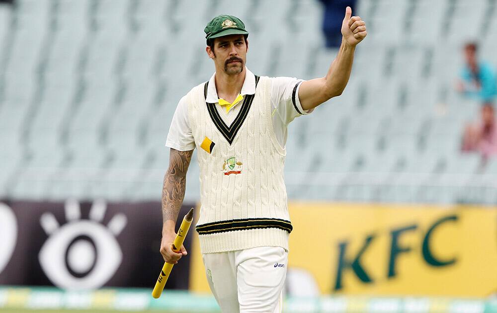 Australia`s Mitchell Johnson waves to the crowd after beating England during the fifth day of the second Ashes cricket test match between England and Australia, in Adelaide.