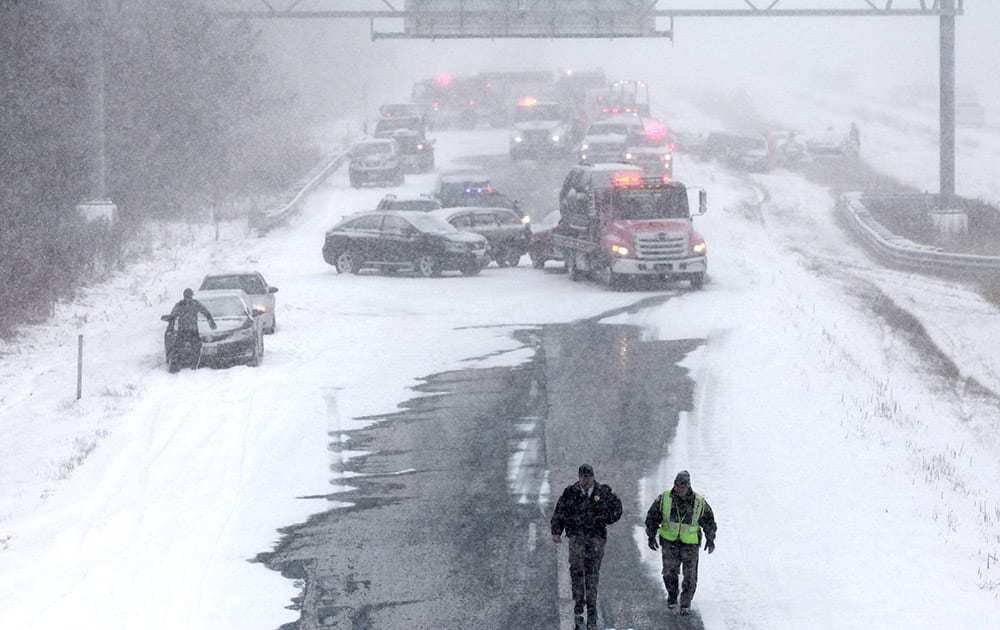 Emergency personnel respond to an accident on southbound Interstate 43 (I-43) south of Mequon Rd near the N. Port Washington Rd overpass in Mequon, Wis.