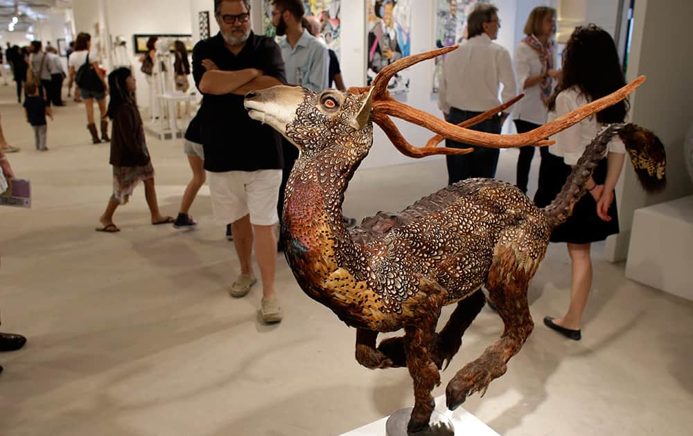 A sculpture made with real animal feathers titled