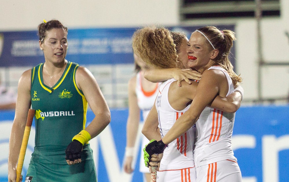 Netherlands` Xan de Waars, right, celebrates with teammates as Australia`s Carrie McMahon, left, looks on during the women`s field hockey World League final game, in San Miguel de Tucuman, Argentina.