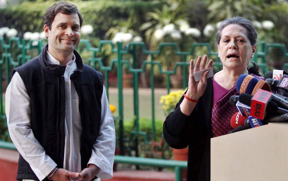Congress President Sonia Gandhi with Vice President Rahul Gandhi addresses the media at AICC in New Delhi.