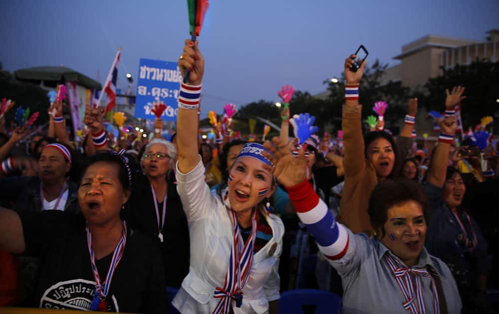 Anti-government protesters shout slogans during a rally at the Democracy Monument in Bangkok, Thailand.