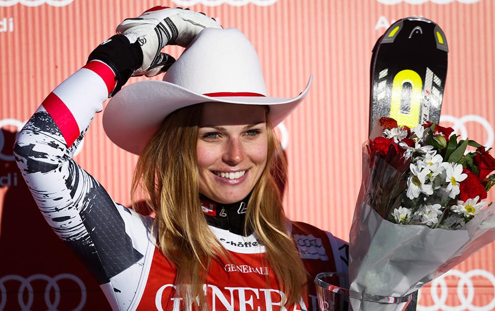 Austria`s Anna Fenninger celebrates her third place finish in the second women`s World Cup downhill skiing race at Lake Louise, Alberta.