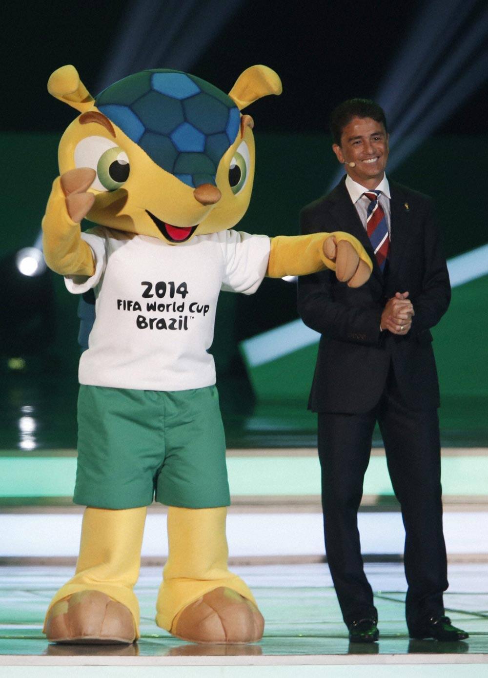 Former Brazilian soccer player Bebeto presents Mascot Fuleco during the draw ceremony for the 2014 soccer World Cup in Costa do Sauipe near Salvador, Brazil.