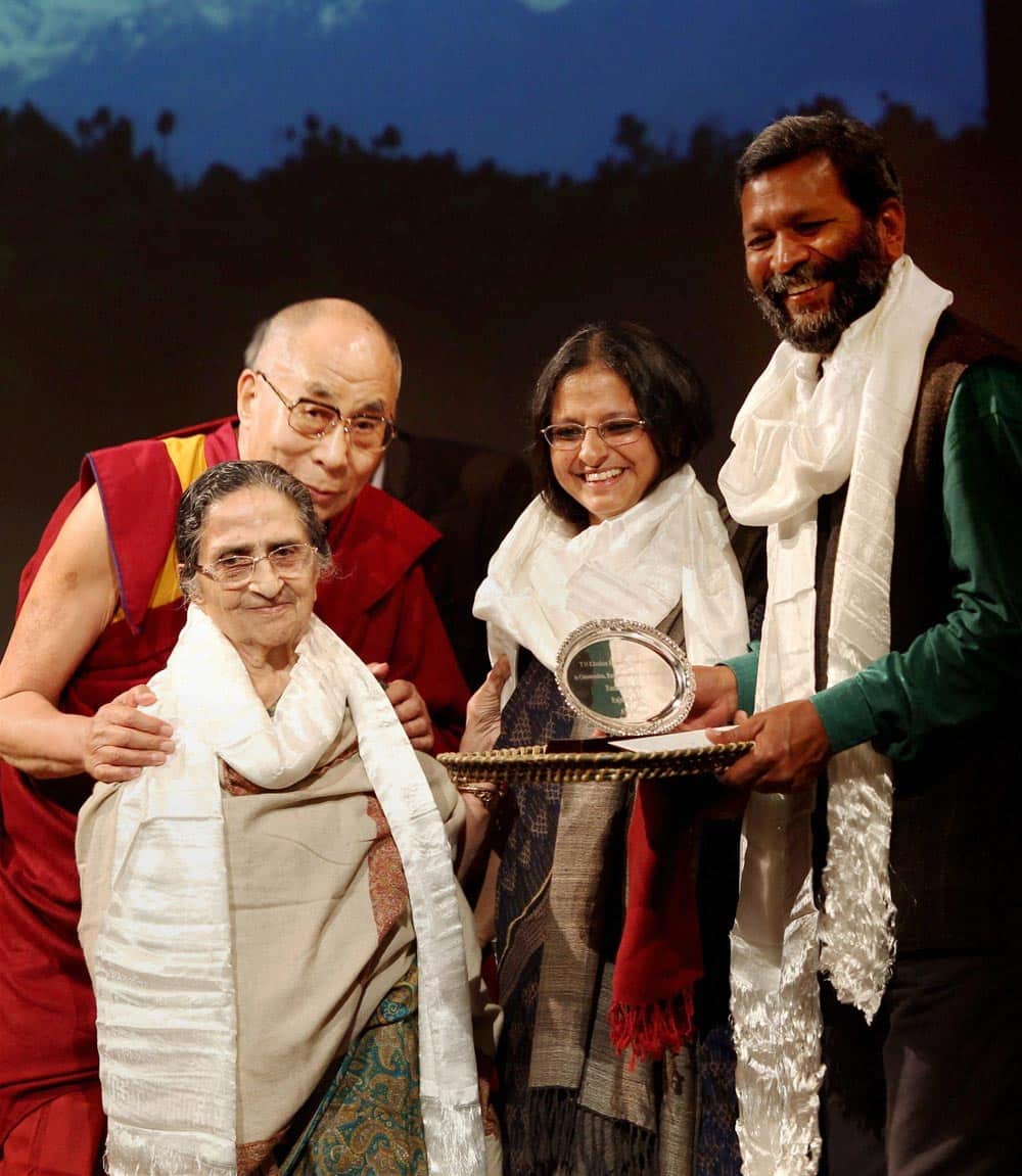 Tibetan spiritual leader Dalai Lama presents 10th T N Khoshoo Memorial Award to Founder of Avani NGO in the Himalayas, Rashmi and Rajnish (R) at a function in New Delhi.