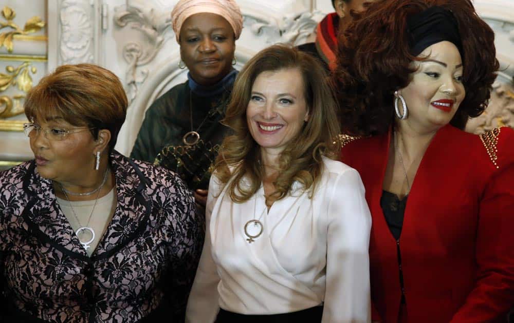 French President Francois Hollande`s companion Valerie Trierweiler, center, poses with, from left, Burkina Faso First Lady Chantal Compaore, Special Representative of the United Nations Secretary General on Sexual Violence in Conflict Zainab Hawa Bangura, and Cameroon`s First Lady Chantal Biya, right, during a family photo at a meeting dubbed `The Mobilisation against sexual violence towards women in conflict` attended by the first ladies of African nations, held alongside the Summit for Peace and Security in Africa, at the Musee d`Orsay, in Paris.