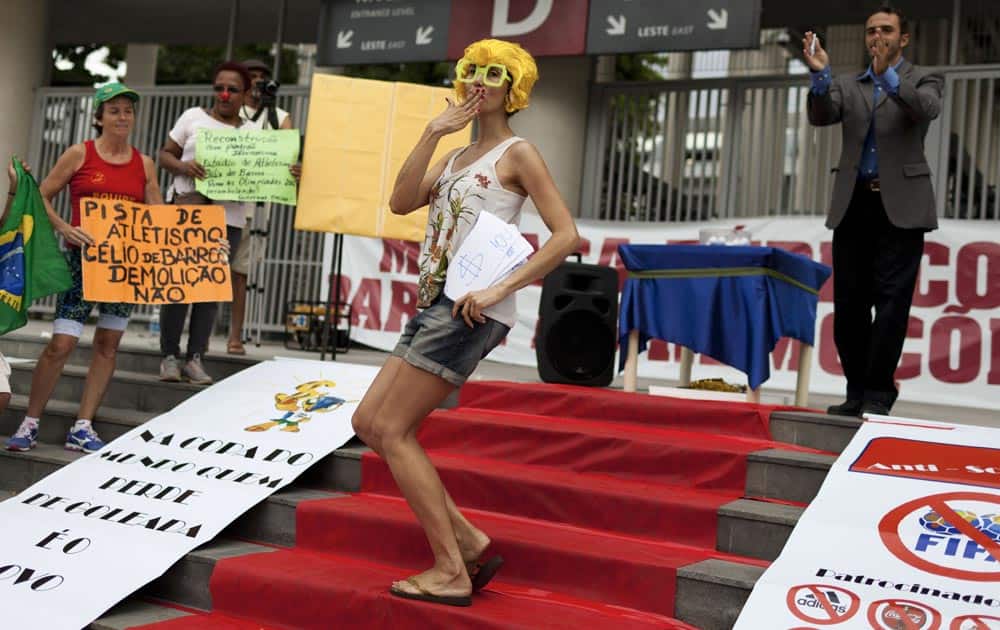 Protestors demonstrate outside of the Maracana Stadium against the 2014 World Cup Final Draw and issues surrounding the soccer tournament, in Rio de Janeiro, Brazil.