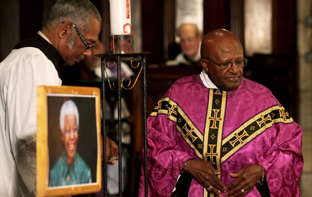 Archbishop Emeritus Desmond Tutu leads a prayer service in memory of former South African president Nelson Mandela, at St George`s Cathedral in Cape Town, South Africa.