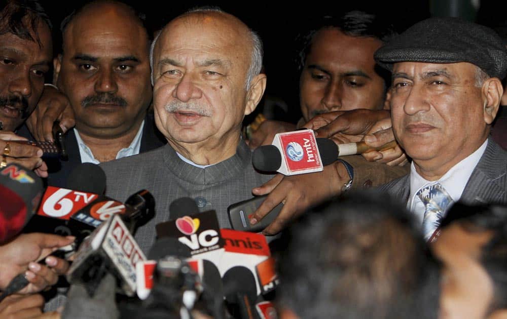 Union Home Minister Sushilkumar Shinde with Home Secretary Anil Goswami addressing the media outside PM House after a Cabinet meeting on Telangana, in New Delhi.