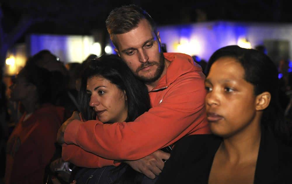 Mourners gather outside the home of former President Nelson Mandela in Johannesburg, South Africa.
