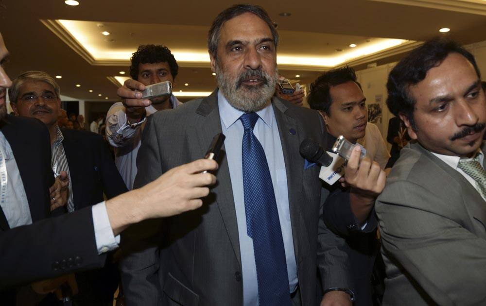 Indian Trade Minister Anand Sharma, center, talks to journalists upon his arrive at the Ninth Ministerial Conference of the World Trade Organization (WTO) in Bali, Indonesia.