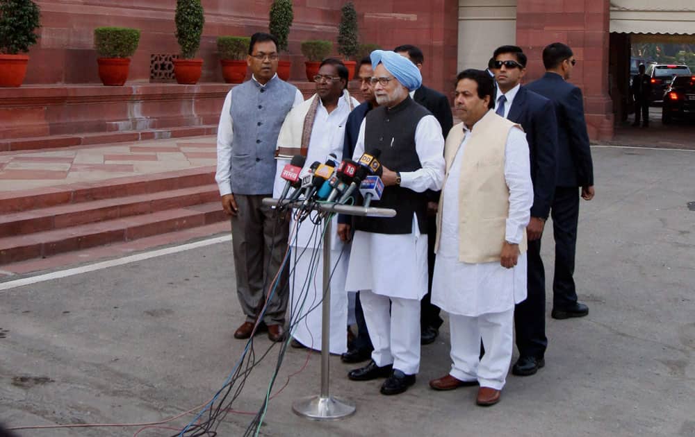 Prime Minister Manmohan Singh, flanked by Parliamentary Affairs Minister Kamal Nath and Ministers of State V Narayanasamy, Paban Singh Ghatowar and Rajiv Shukla, arrives to address the media on the first day of the Winter Session in New Delhi.