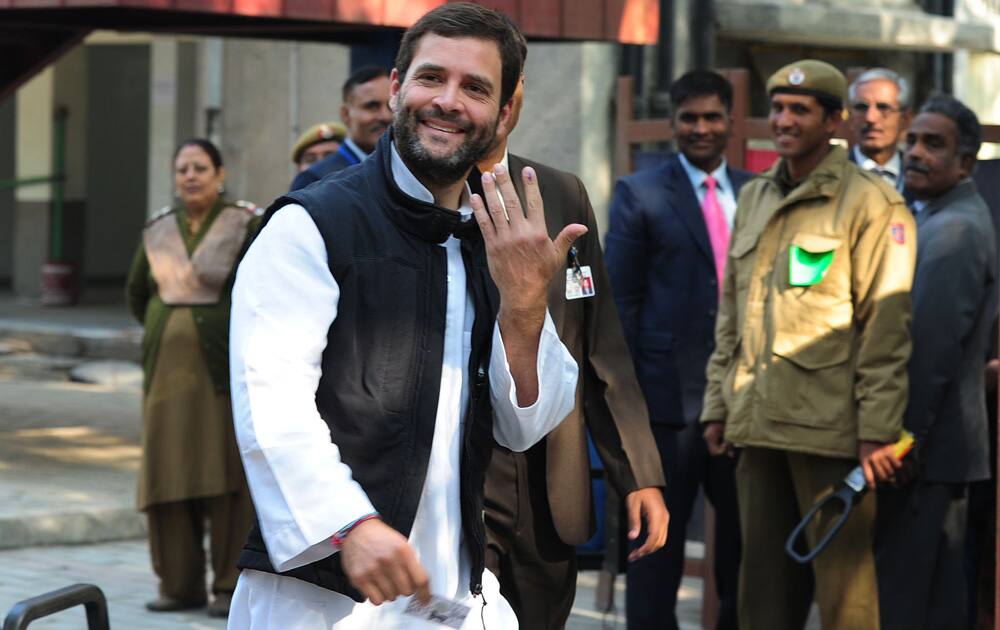 Congress Vice President Rahul Gandhi shows his inked finger after casting his vote for Delhi Assembly elections, at a polling station in New Delhi.Pic Courtesy- DNA
