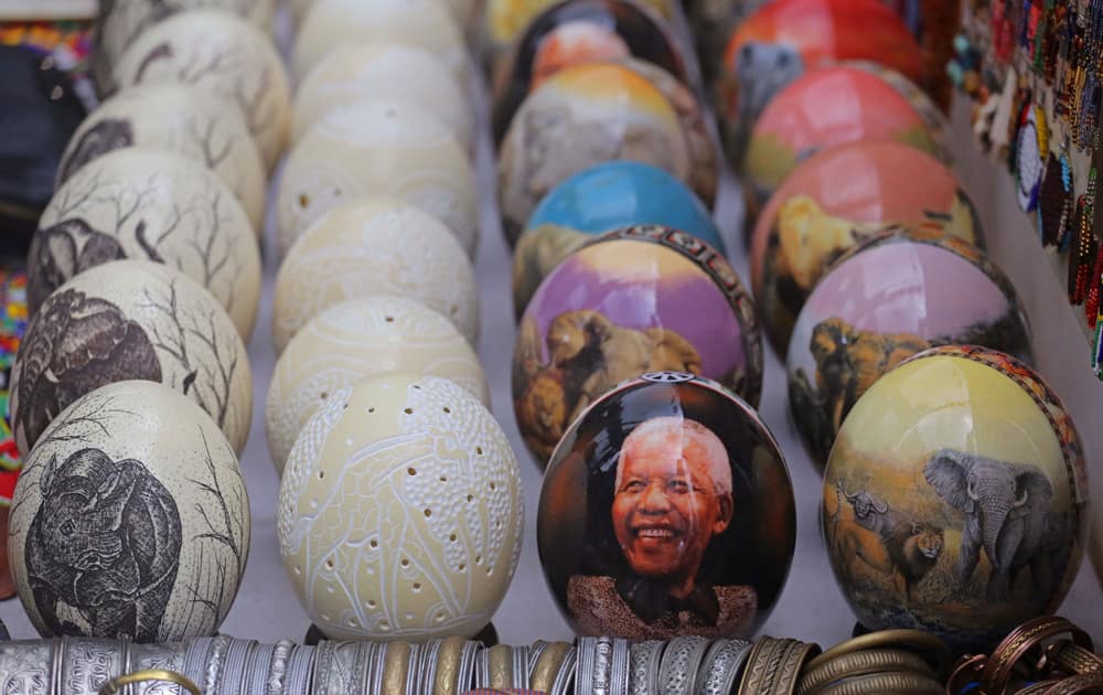 An ostrich egg painted with the face of former South African president Nelson Mandela in a street that sells African style art to tourists in the city of Cape Town, South Africa.