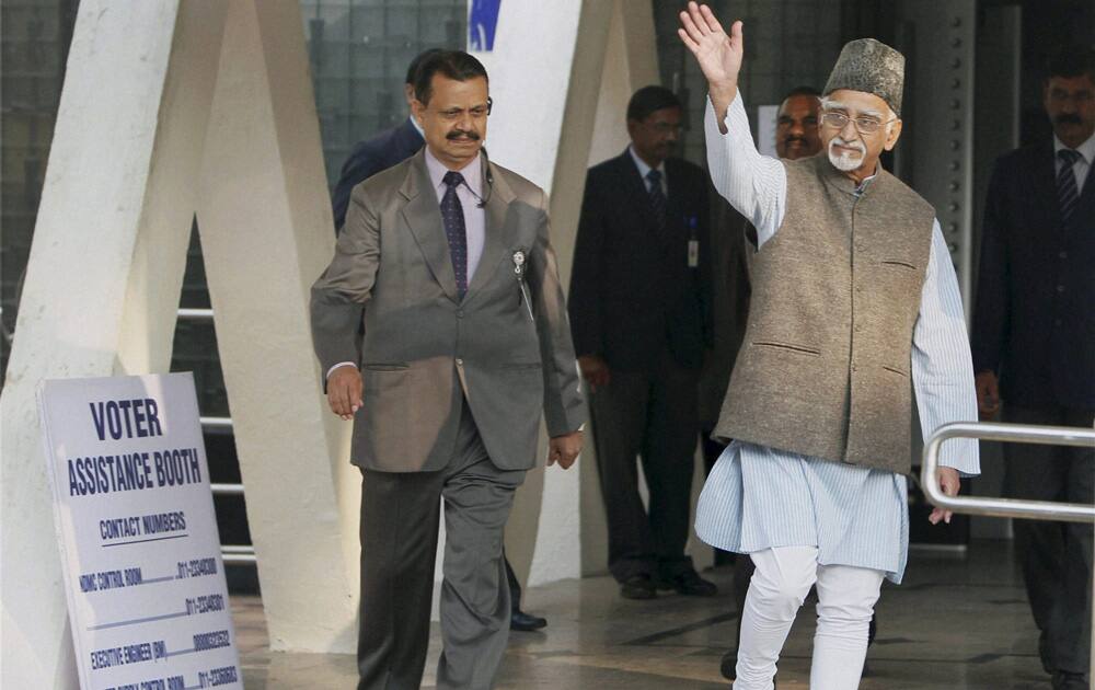 Vice President Hamid Ansari leaves after casting his vote for Delhi Assembly elections at Nirman Bhawan polling station in New Delhi.