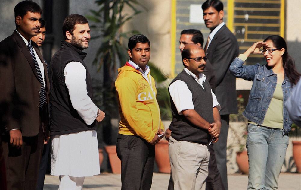 Congress Vice President Rahul Gandhi waits in a queue to cast his vote for Delhi Assembly elections, at a polling station in New Delhi.