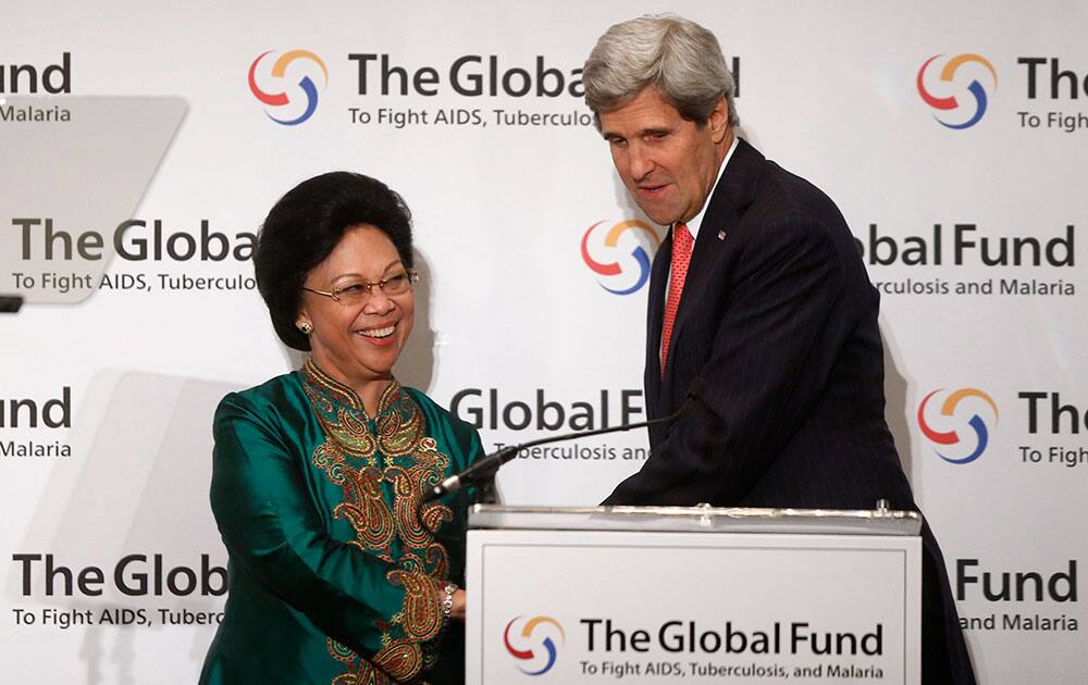 Secretary of State John Kerry is introduced by Indonesian Minister of Health Mafsiah Mboi before he speaks at The Global Fund to Fight AIDS, Tuberculosis, and Malaria meeting in Washington.