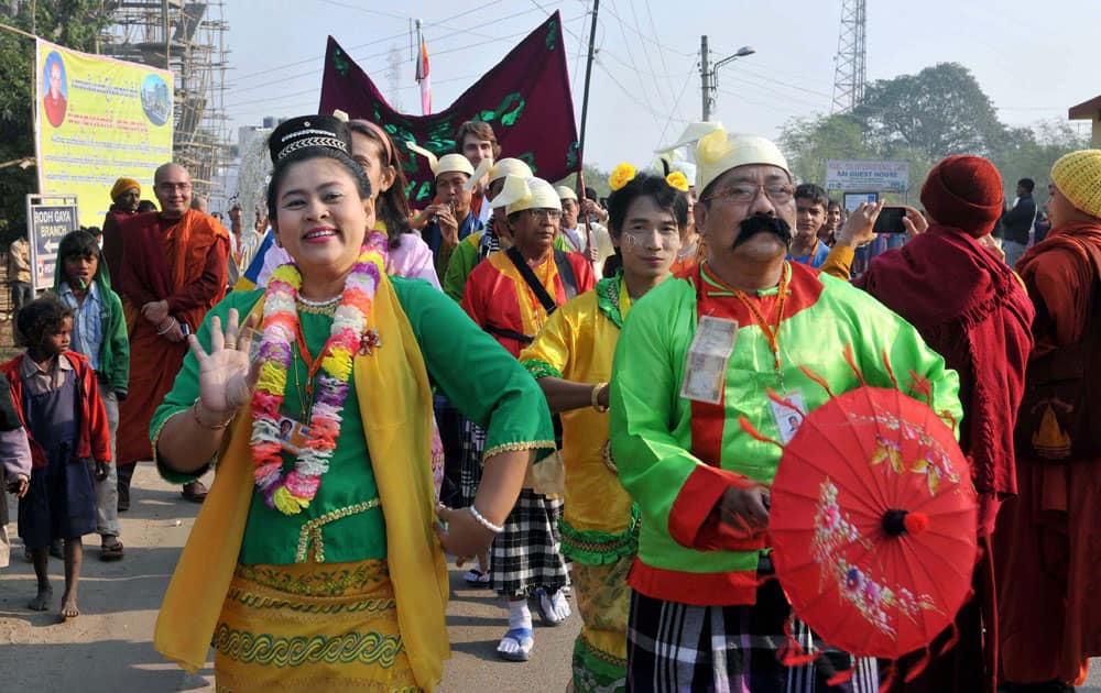 Foreign Buddhist devotees take part in a procession during the 9th International Tipitika Chanting ceremony in Bodhgaya.
