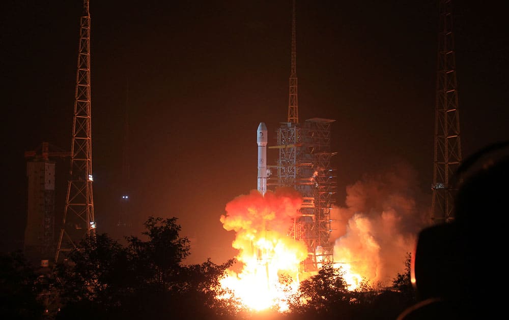 In this photo released by China`s Xinhua News Agency, the Long March 3B rocket carrying the Chang`e-3 lunar probe blasts off from the launch pad at Xichang Satellite Launch Center, southwest China`s Sichuan Province.