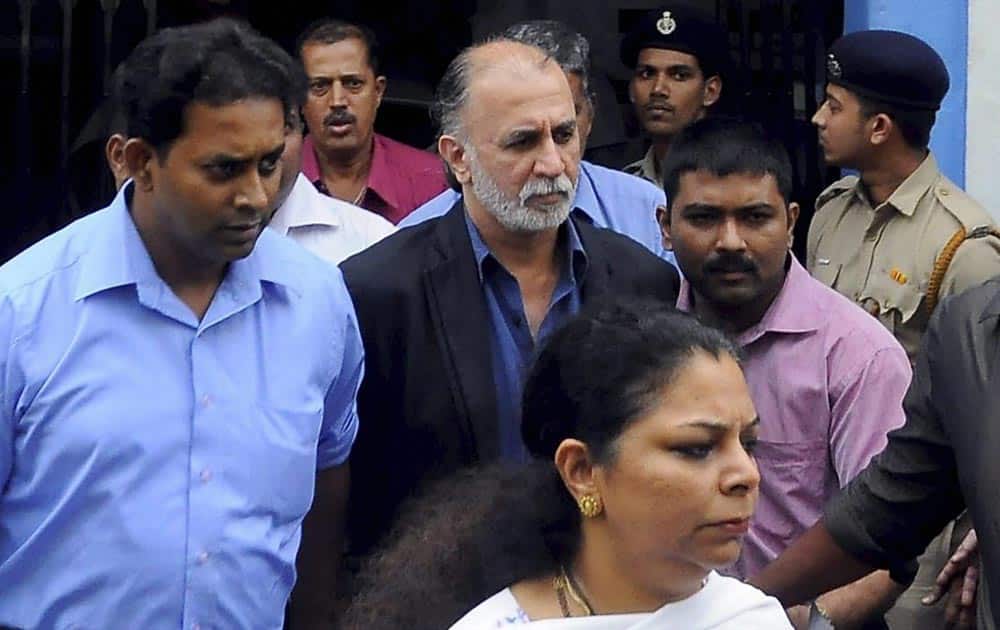 Tarun Tejpal is escorted after being produced at the Sessions Court in a sexual assault case in Panaji.