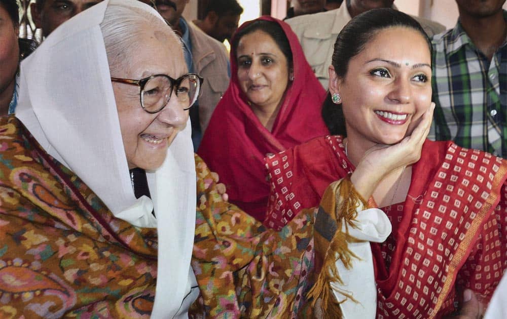BJP candidate Siddhi Kumari with her mother and grandmother before casting vote at a polling station in Bikaner during Rajasthan Assembly polls.