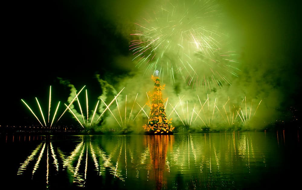 Fireworks explode over a floating Christmas tree in Lagoa lake at the annual holiday tree lighting event in Rio de Janeiro, Brazil.