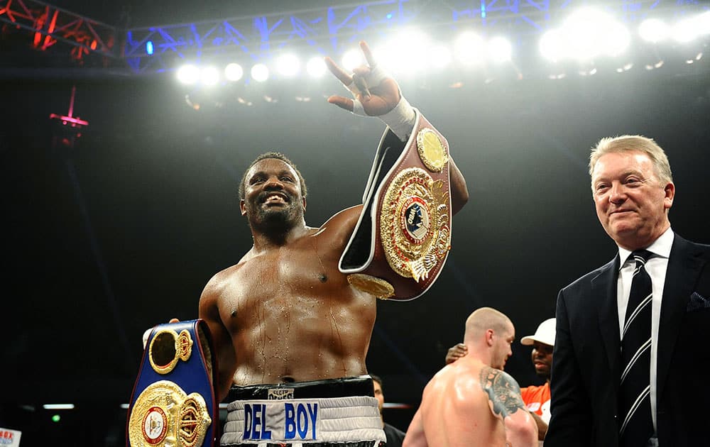 Britain`s Dereck Chisora celebrates after winning his WBO and WBA international heavyweight title fight against Ondrej Pala of the Czech Republic, at the Copper Box Arena, Queen Elizabeth Olympic Park, in London.