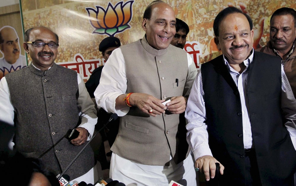 BJP president Rajnath Singh with party`s CM candidate for Delhi Assembly polls Harsh Vardhan and Delhi unit President Vijay Goel at a press conference at state party office in New Delhi.