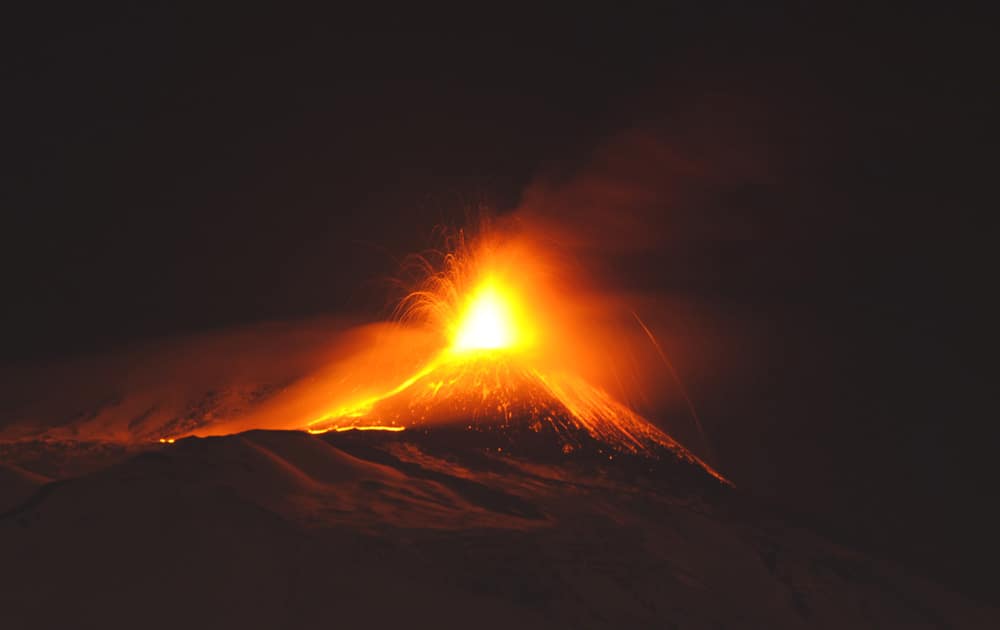 Mt. Etna spews lava during an eruption near the Sicilian town of Catania, Italy. Mt. Etna is Europe`s tallest active volcano, at 3329 m (10,921 ft).