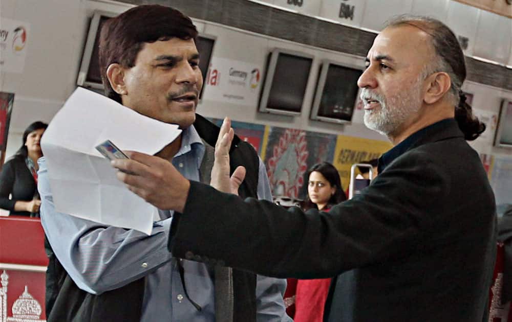 Tehelka editor-in-chief Tarun Tejpal at the Indira Gandhi International Airport in New Delhi on Friday before boarding flight to Goa.