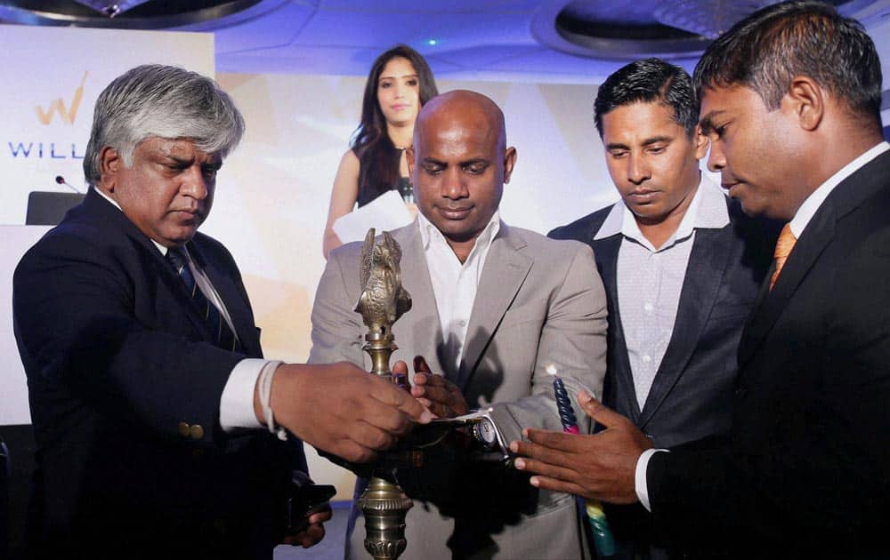 Formar Sri Lanka crickters Arjuna Ranatunga, Sanath Jayasuriya, Chaminda Vaas and Ramesh Kaluwitharana light lamps during an event in Mumbai for the launch of a Real Estate project in Sri Lanka.