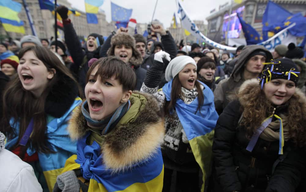 Ukrainian students shout slogans during a demonstration to support European Union integration at Independence Square in Kiev, Ukraine.