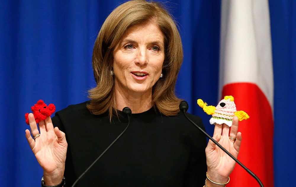 US Ambassador to Japan Caroline Kennedy, holds knitted pot scrubbers that tsunami survivors in Minamisanriku made at temporary housing facility, during a welcome luncheon hosted by the America-Japan Society and the American Chamber of Commerce in Japan, in Tokyo, Japan