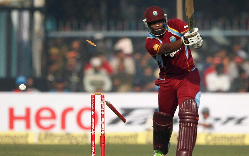 West Indies batsman J Charles being bowled by India`s B Kumar during their last ODI match against India at Green Park stadium in Kanpur.