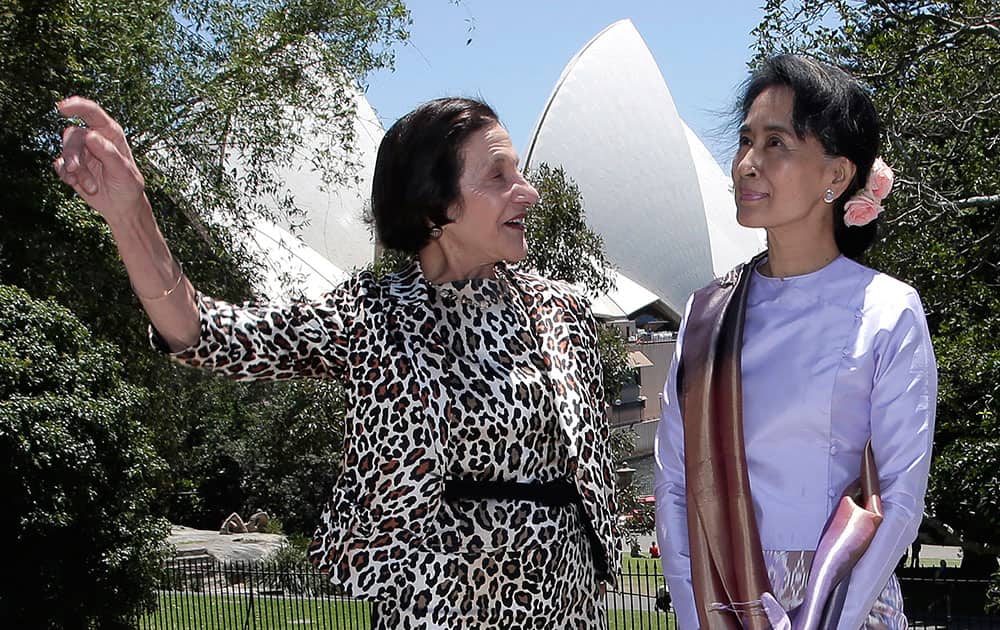 Myanmar pro-democracy leader Aung San Suu Kyi, right, poses with New South Wales state governor Marie Bashir at Government House in Sydney.