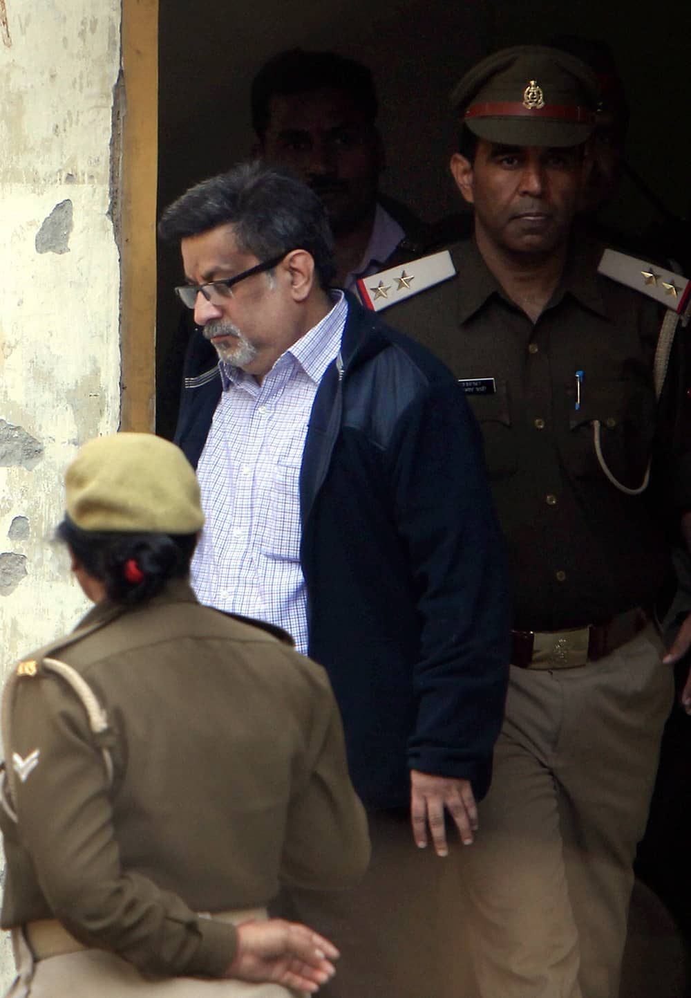 Rajesh Talwar arrives at the special CBI Court from the jail in Ghaziabad. The court sentenced Rajesh and Nupur Talwar to life imprisonment for killing their daughter Aarushi and domestic help Hemraj Banjade.