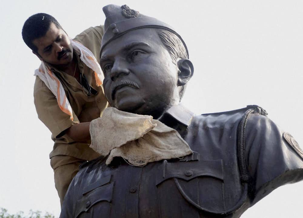 A worker cleans a statue of 26/11 terror attacks martyr Tukaram Omble in Mumbai on the eve of the fifth anniversary of the gruesome incident.