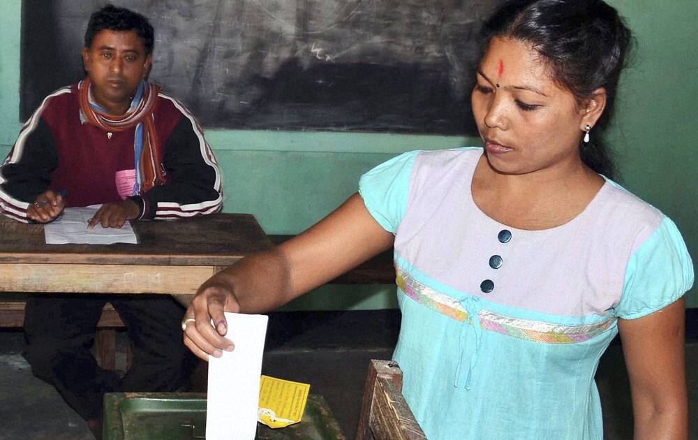 A woman casting her vote during the 3rd and final phase of Rabha-Hasong Autonomous Council polls, at a polling station in Kamrup district of Assam.