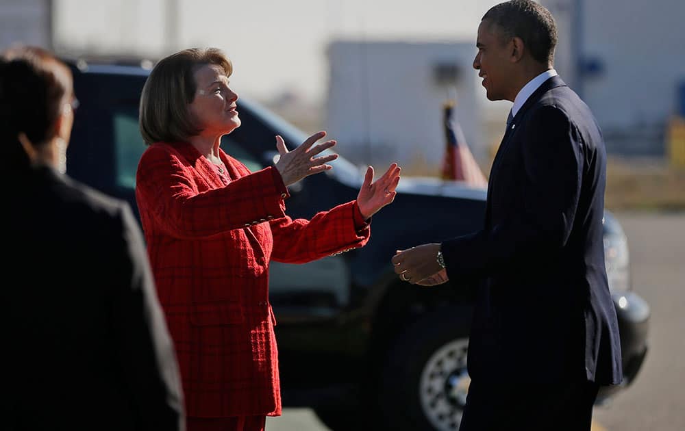 Sen. Dianne Feinstein, D-Calif. greets President Barack Obama on the tarmac upon his arrival on Air Force One at San Francisco International.