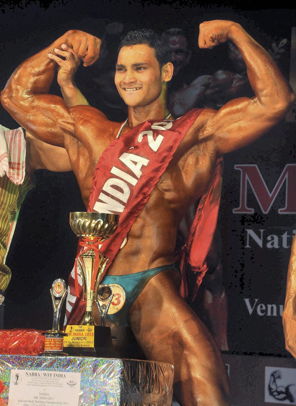 Bikash Kumar Sahoo of Odisha poses after winning the 1st National Body Building Championship 2013 in Guwhati.