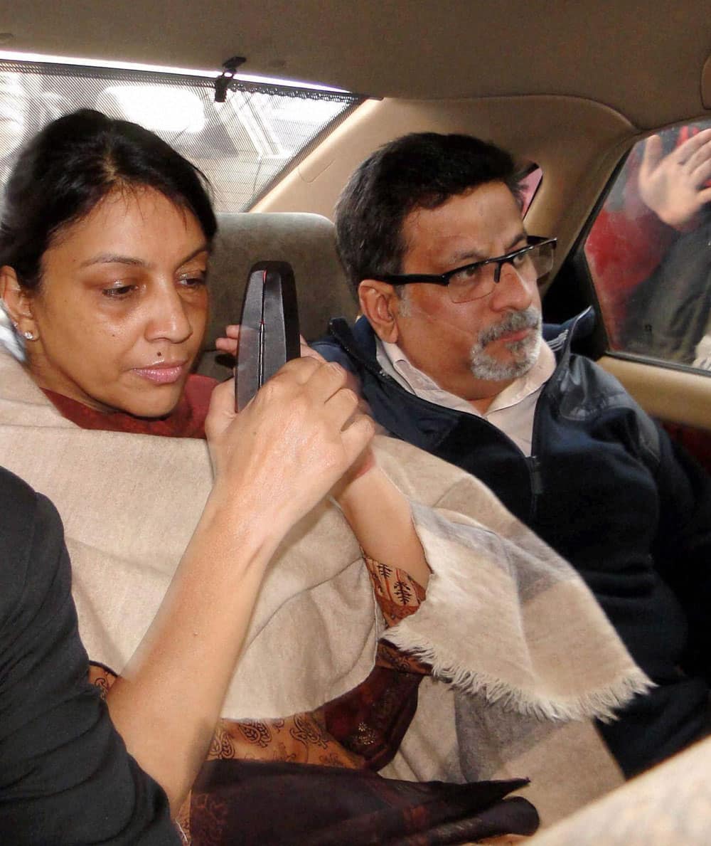 Nupur Talwar and Rajesh Talwar arrive at the special CBI court in Ghaziabad on Monday to hear the verdict in the twin murder case of their daughter Aarushi and domestic help Hemraj. The court convicted Talwar couple in the case.
