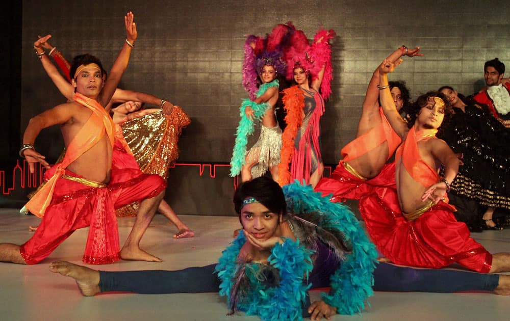 Artists perform at the launch of the 4th generation Honda City car at a world premiere event in New Delhi.