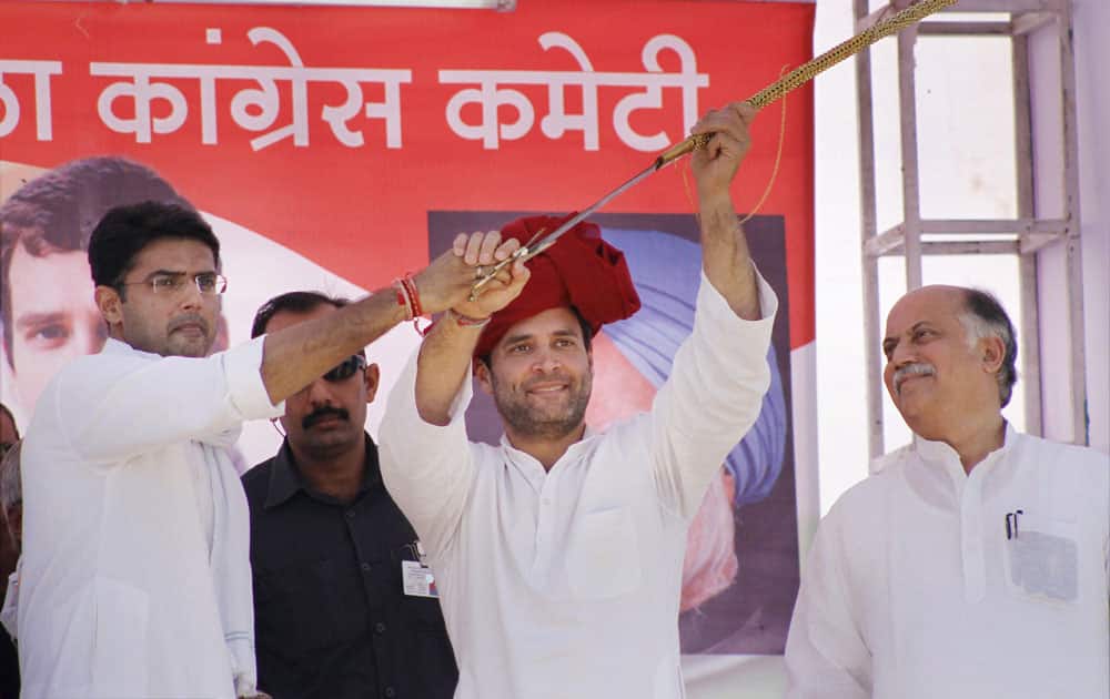 Minister of State for Corporate Affairs Sachin Pilot presents a sword to AICC Vice President Rahul Gandhi during an election rally in Pushkar.
