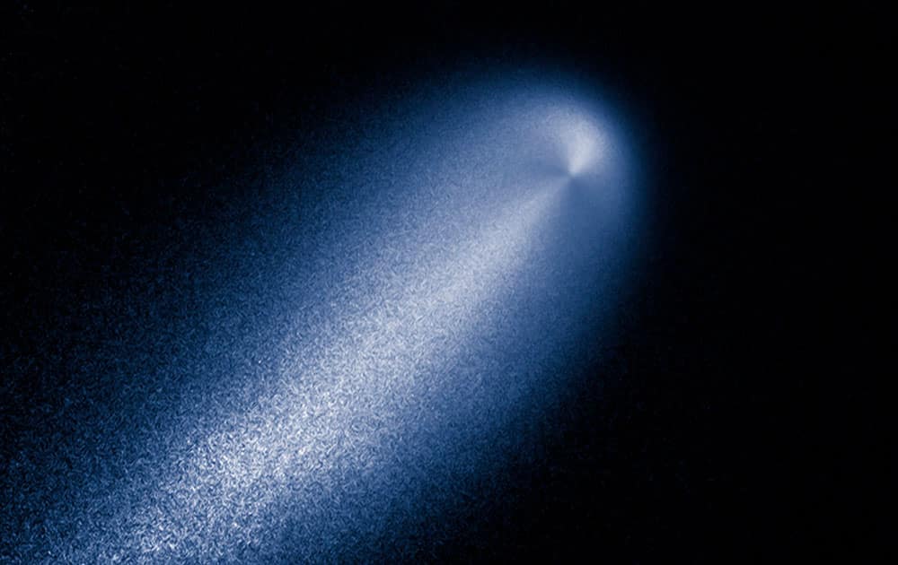 In this photo provided by NASA, a contrast-enhanced image produced from the Hubble images of comet ISON taken April 23, 2013 reveals the subtle structure in the inner coma of the comet.