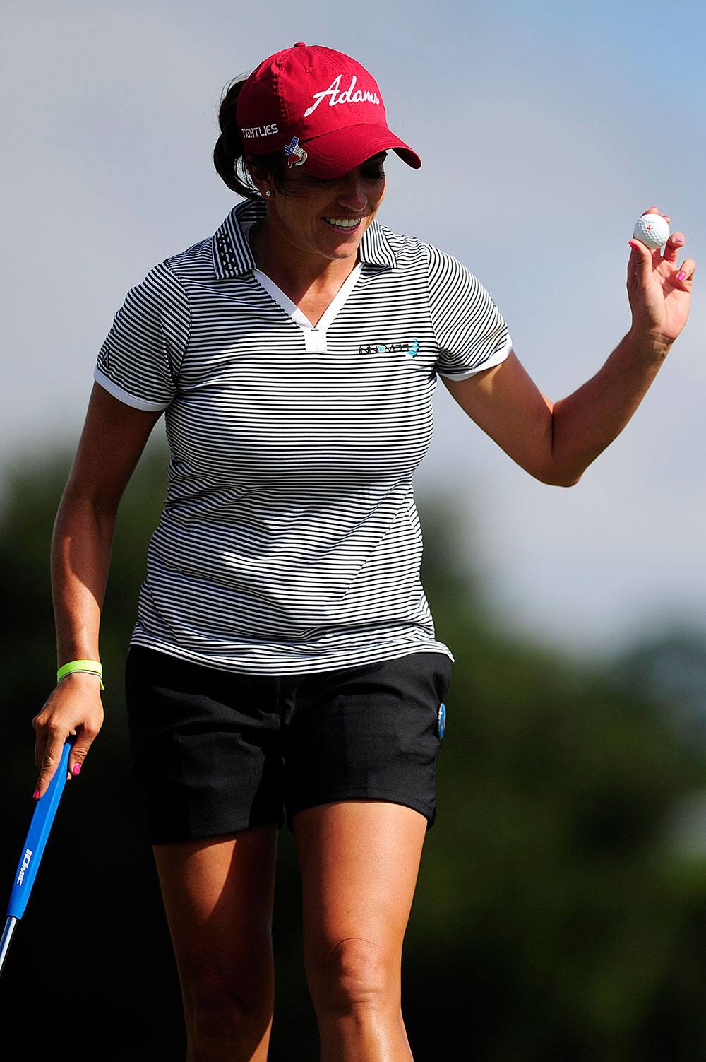 Gerina Piller waves to the crowd after sinking a putt on ninth hole during the final round of the CME Group Titleholders golf tournament at Tiburon Golf Club in Naples, Fla.
