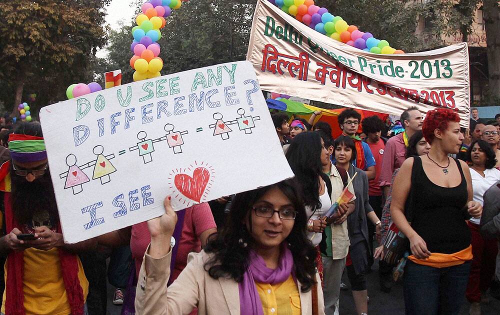 Lesbians, Gay, Bisexual and Trans-genders (LGBT) at the Delhi Queer Pride parade 2013 in New Delhi.