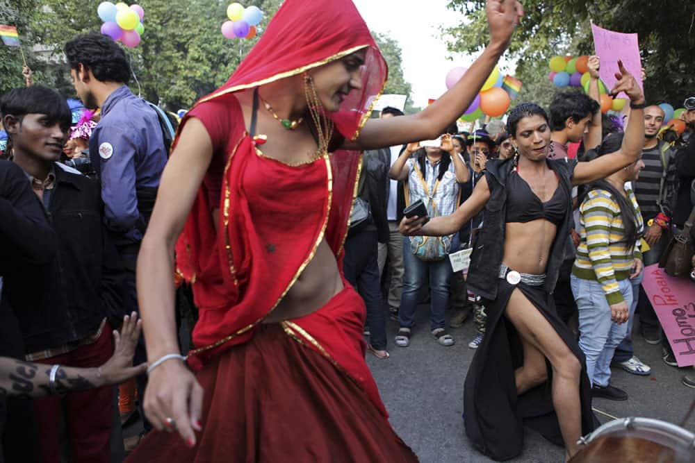 Gay rights activists dance as they march in New Delhi. Hundreds of gay rights activists marched to demand an end to the stigmatization of gay people in India`s deeply conservative society.
