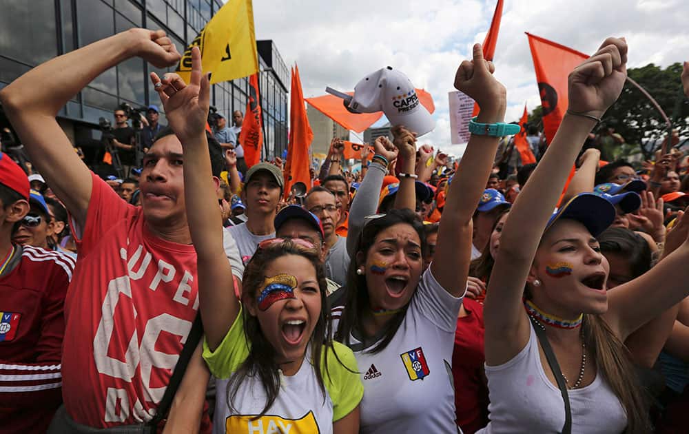 Supporters of opposition leader Henrique Capriles greet him upon his arrival to lead a protest against Venezuela`s President Nicolas Maduro in Caracas, Venezuela.