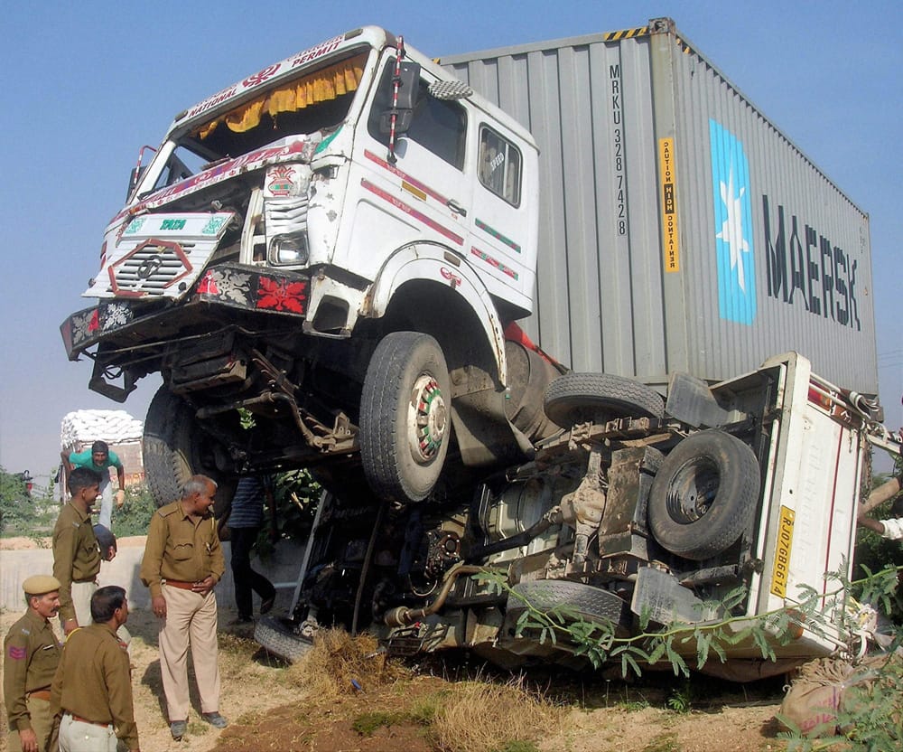 Police men at the accident site after a collision between a truck and a jeep at NH-15 in Bikaner.